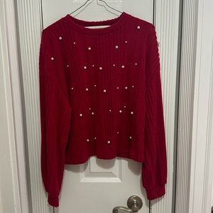 Red sweater with faux pearls